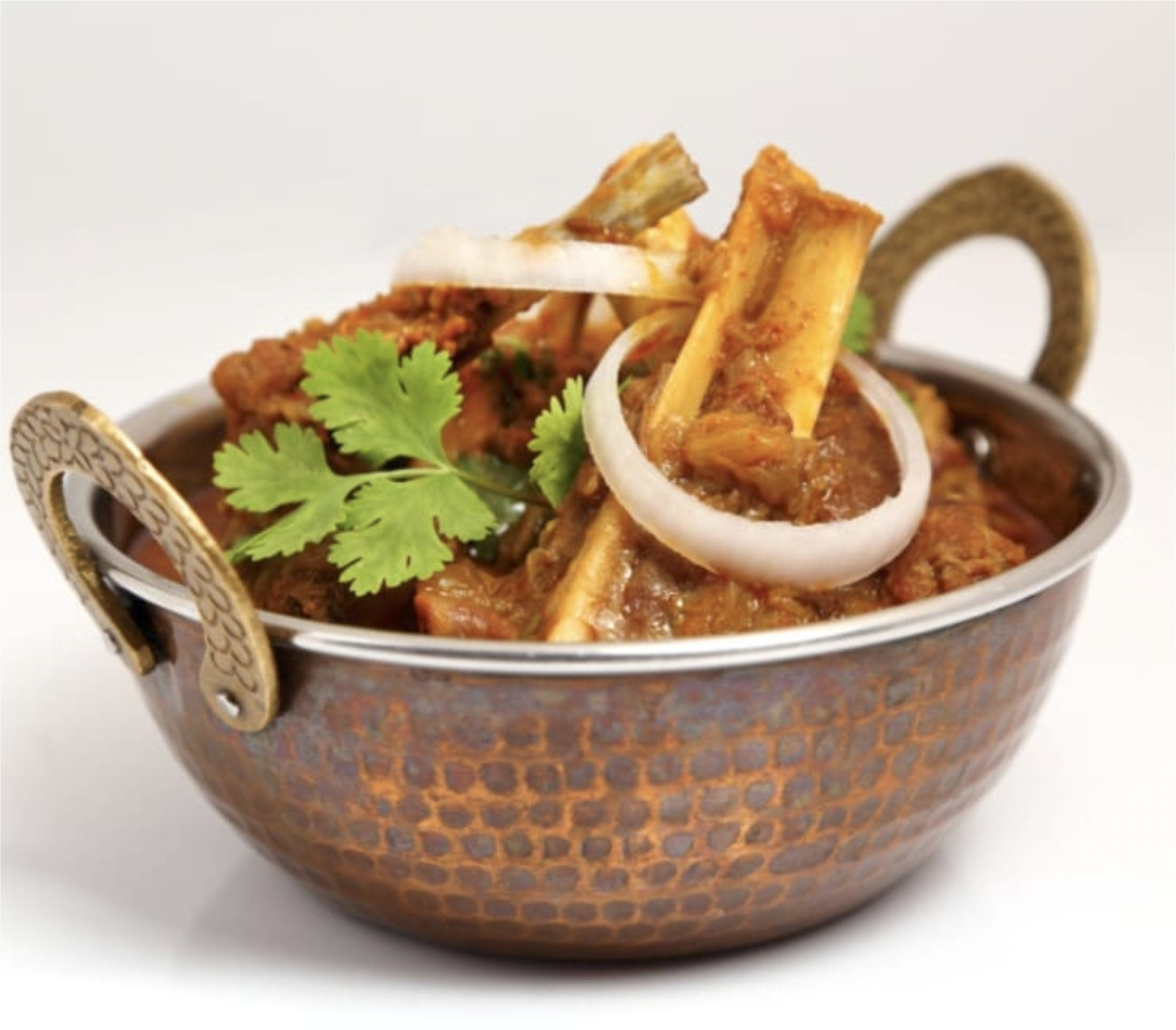 Goat curry cooked in a black pot